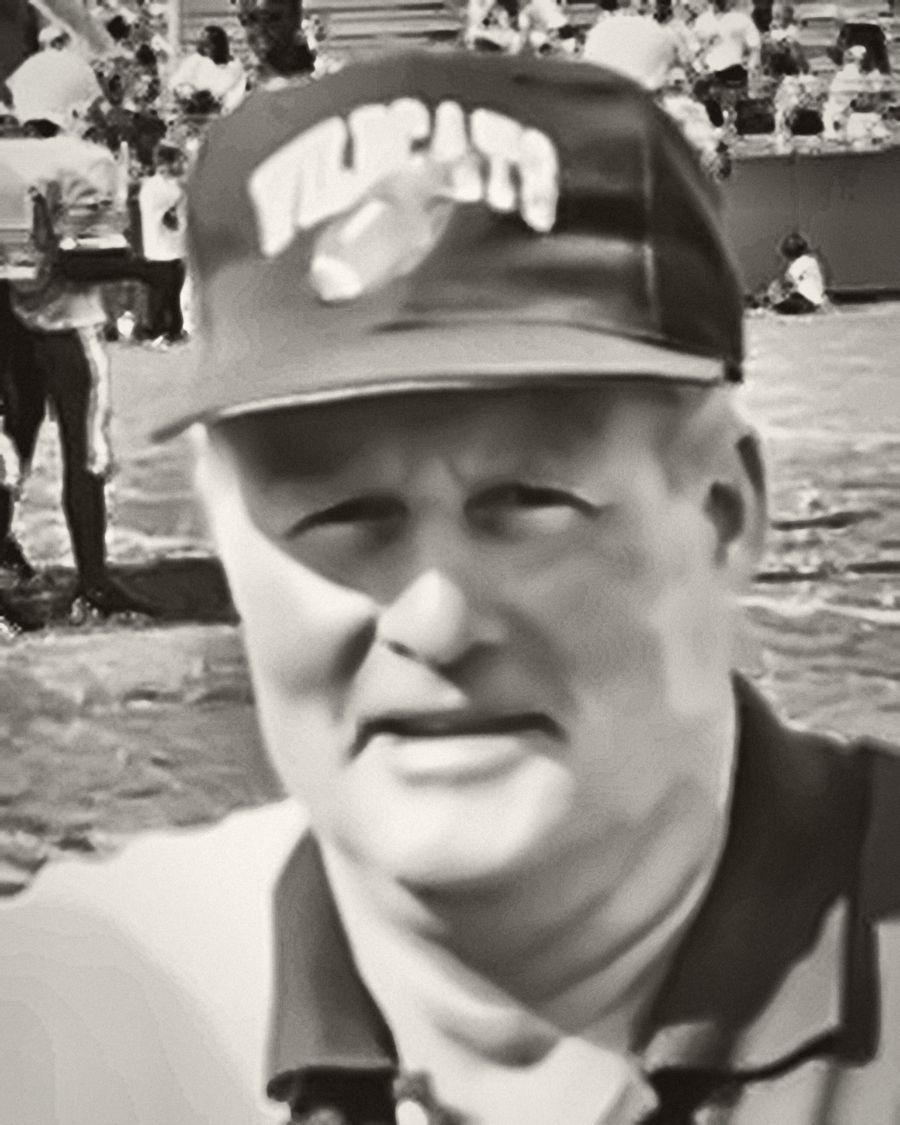 Coach Maurice Wren in a Wildcats cap on the sideline, restored black-and-white portrait.